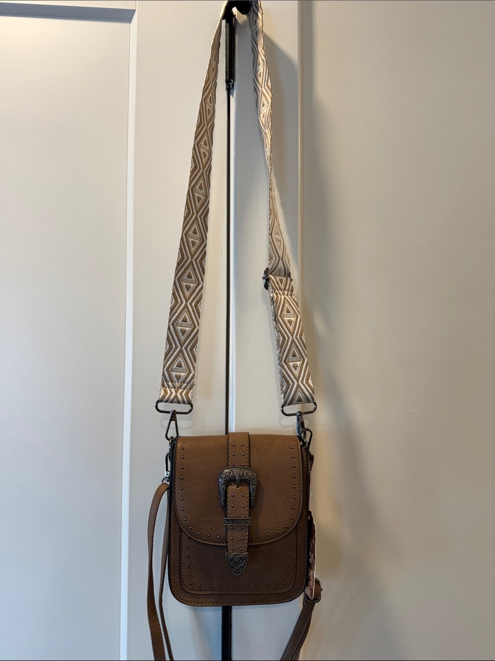 Women's Tan Crossbody Bag with Decorative Buckle and Patterned Strap